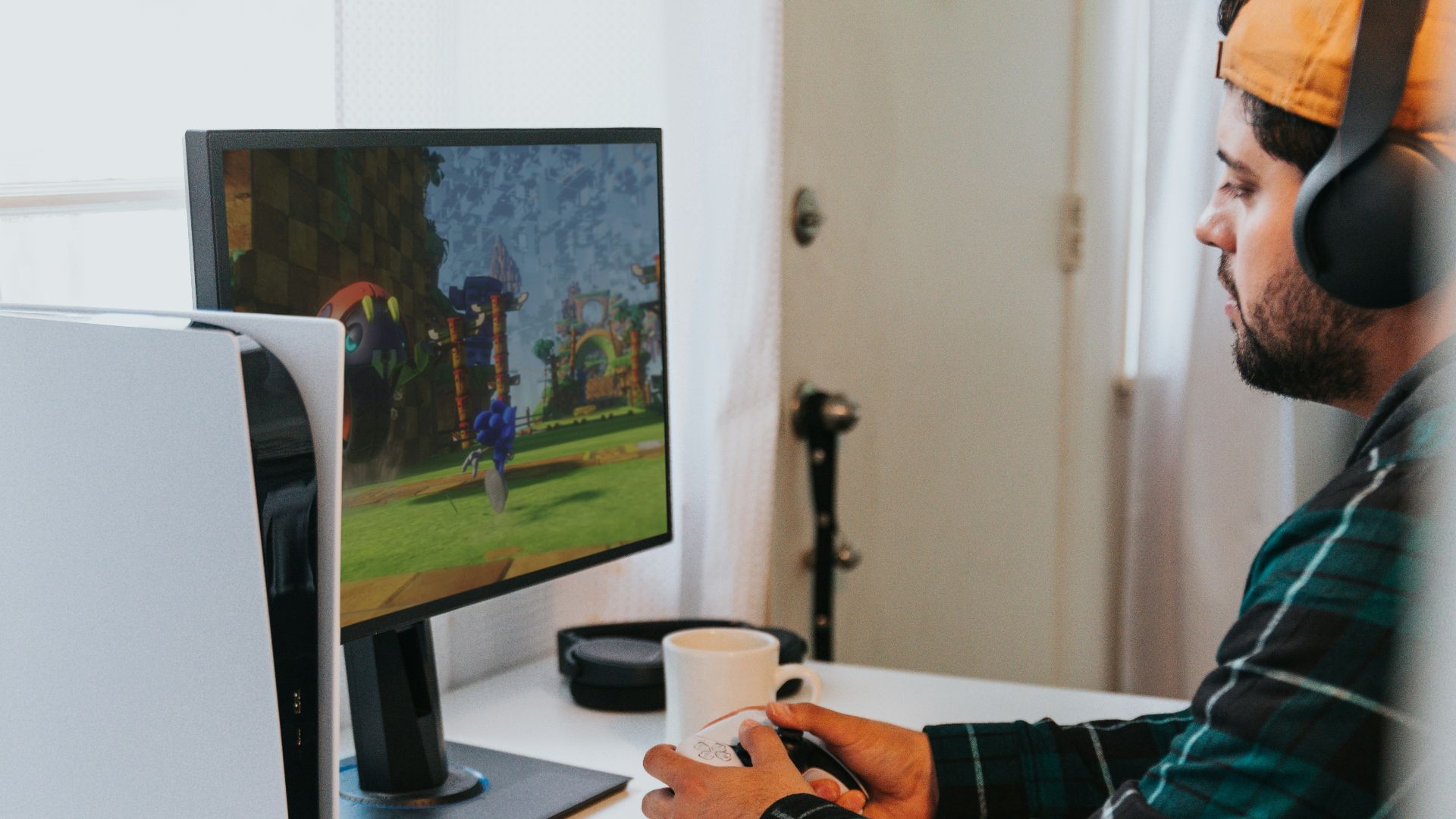 a person wearing a mask and sitting at a desk