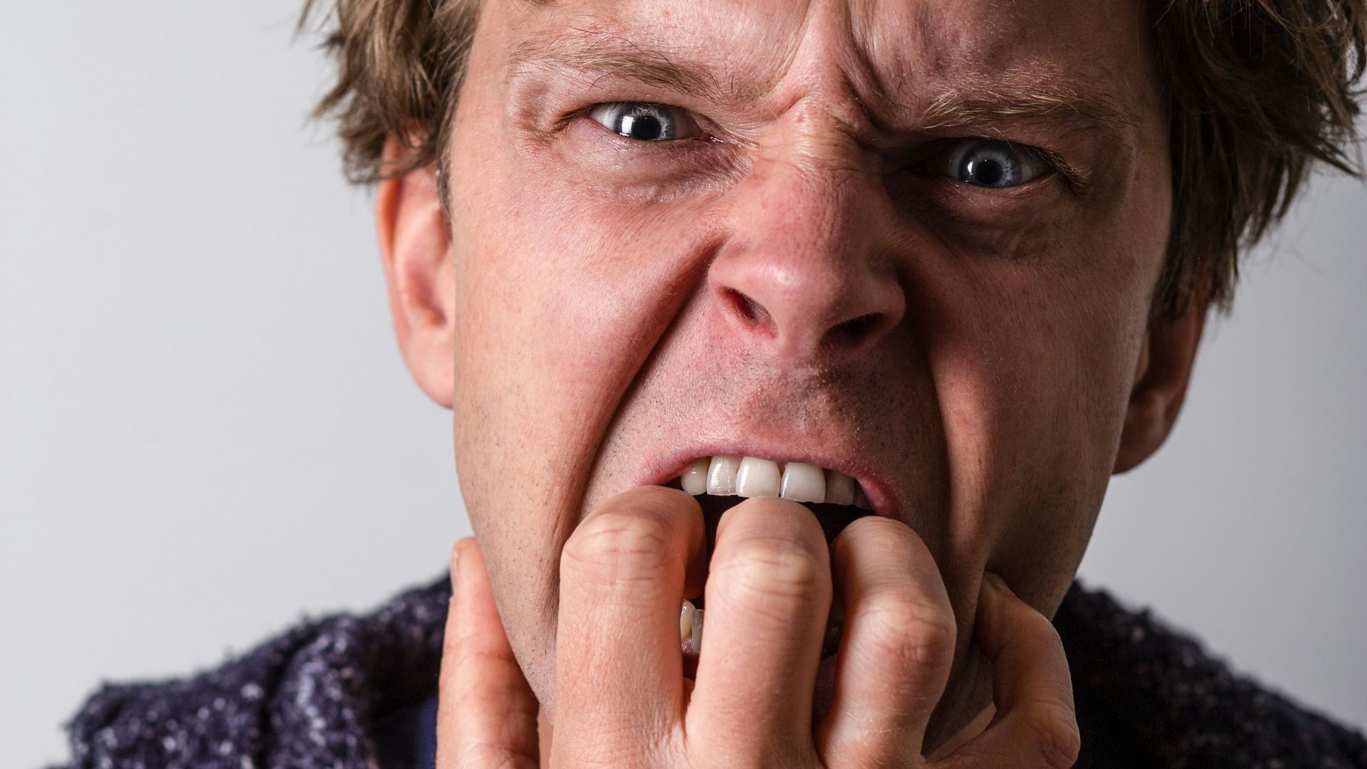 man in blue and white long sleeve shirt