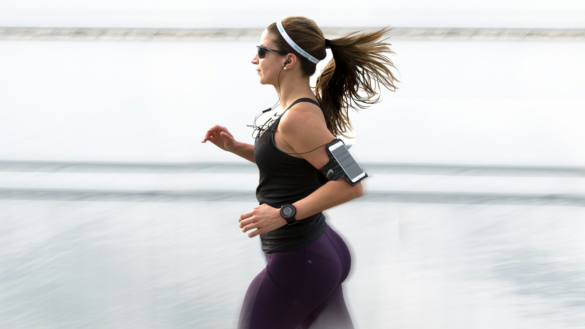 woman running wearing armband