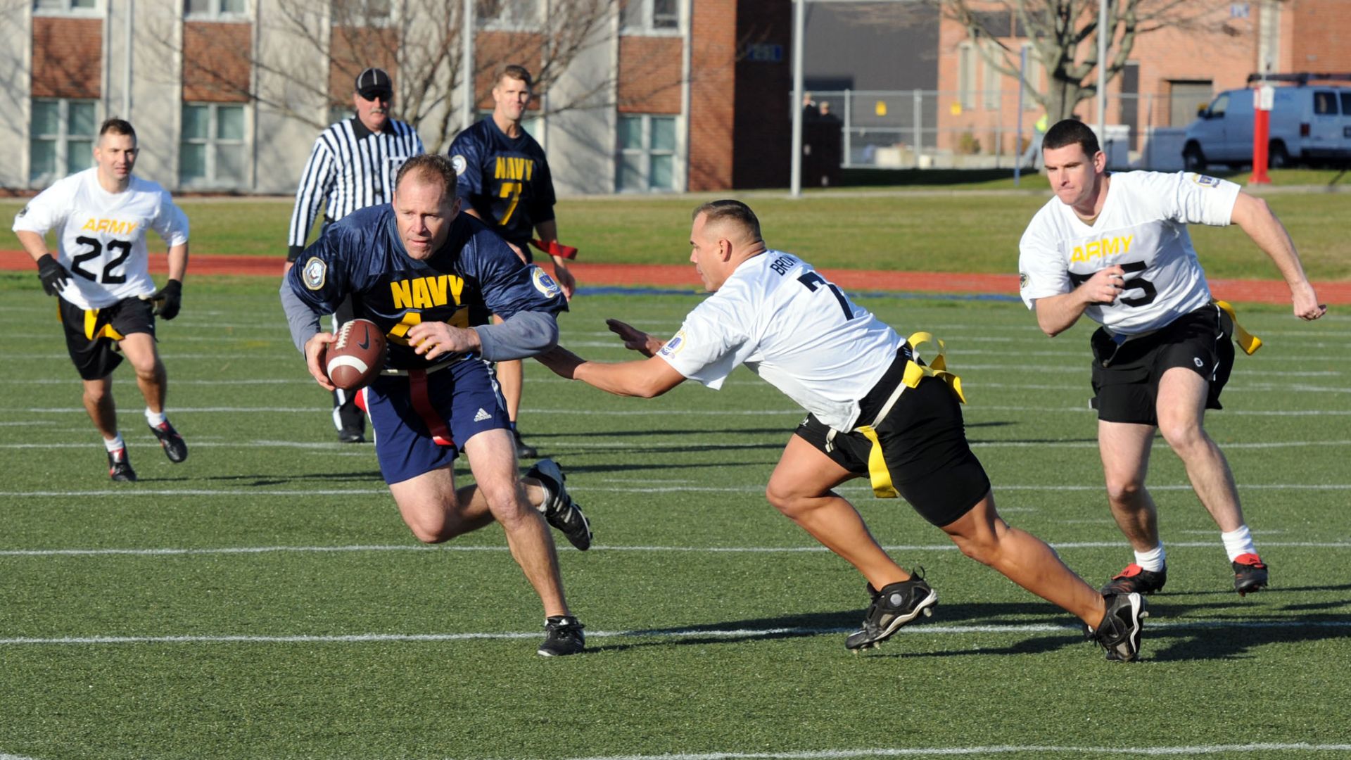 File:US Navy 111202-N-FC065-001 Cmdr. Bill Mallory tries for more yards after a reception during a flag football game celebrating the annual Army-Navy f.jpg