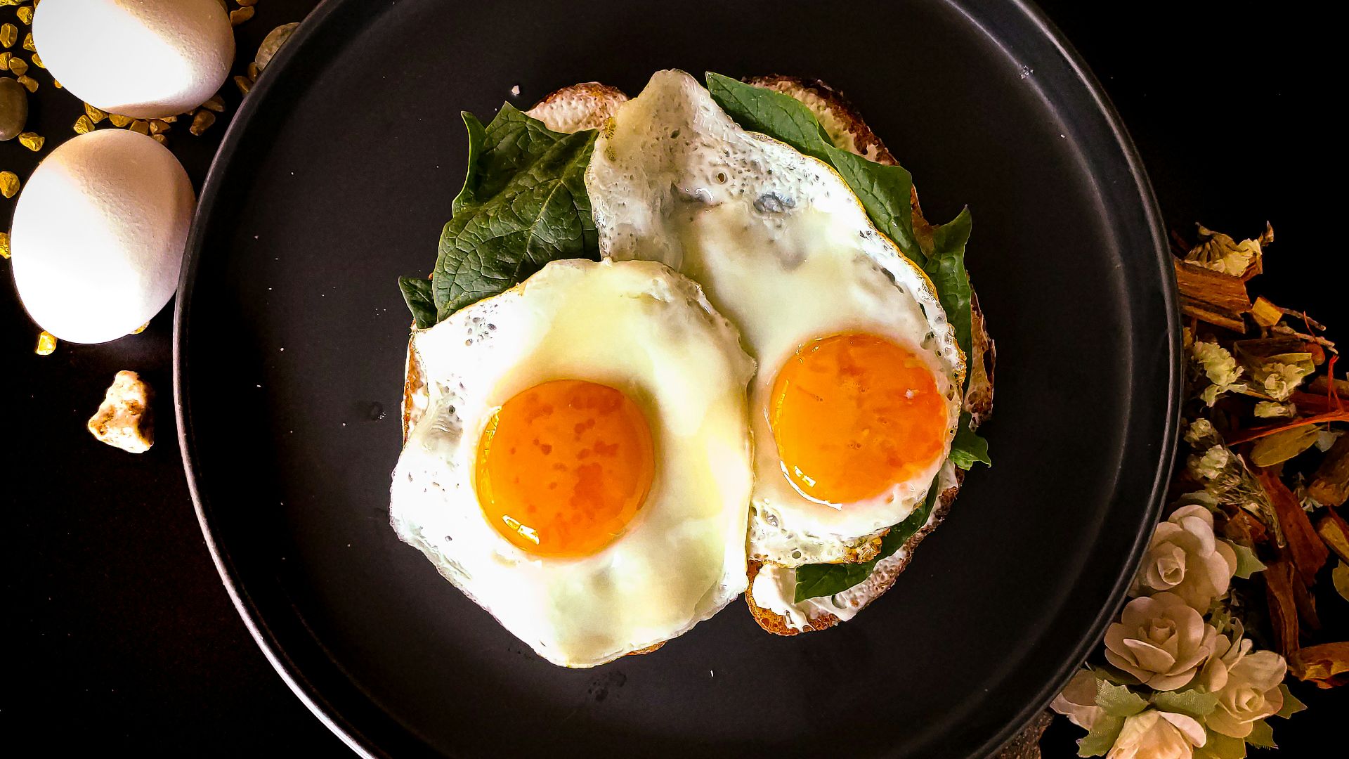 sunny side up egg on black ceramic plate
