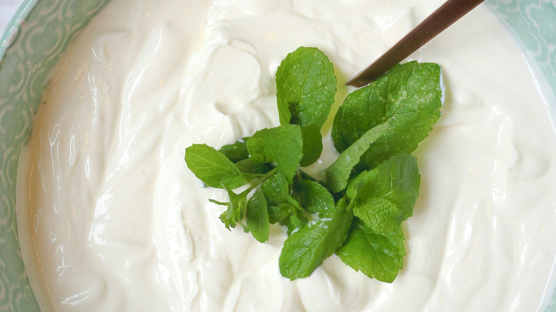 a bowl of yogurt with a spoon in it