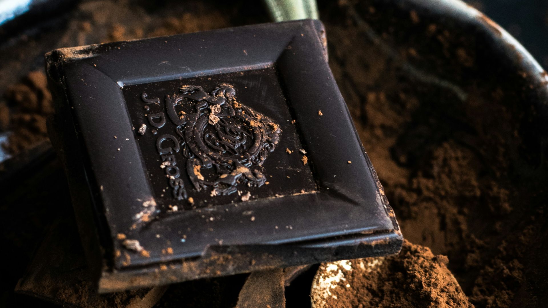 chocolate bar and powder in bowl