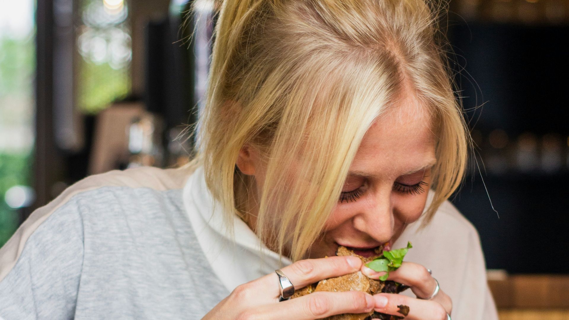woman eating burger