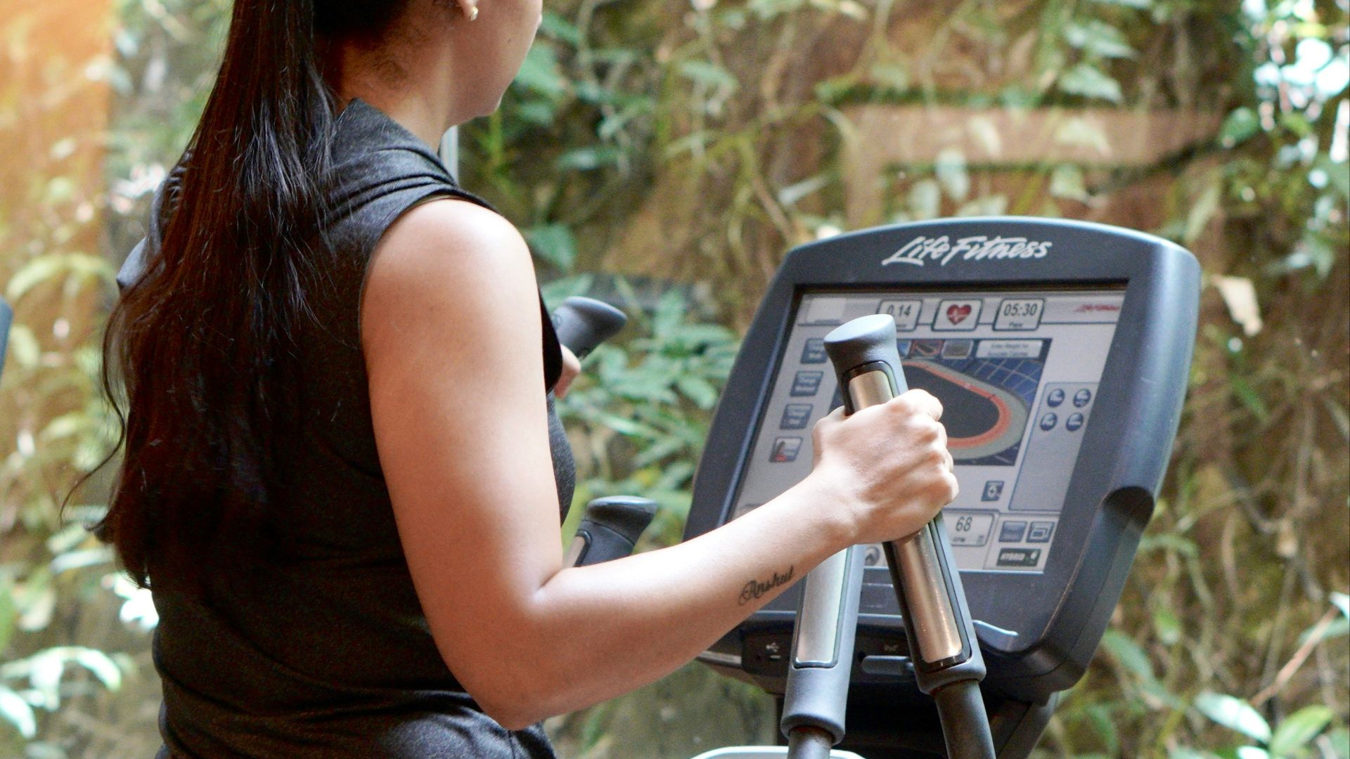 a woman using a weight machine