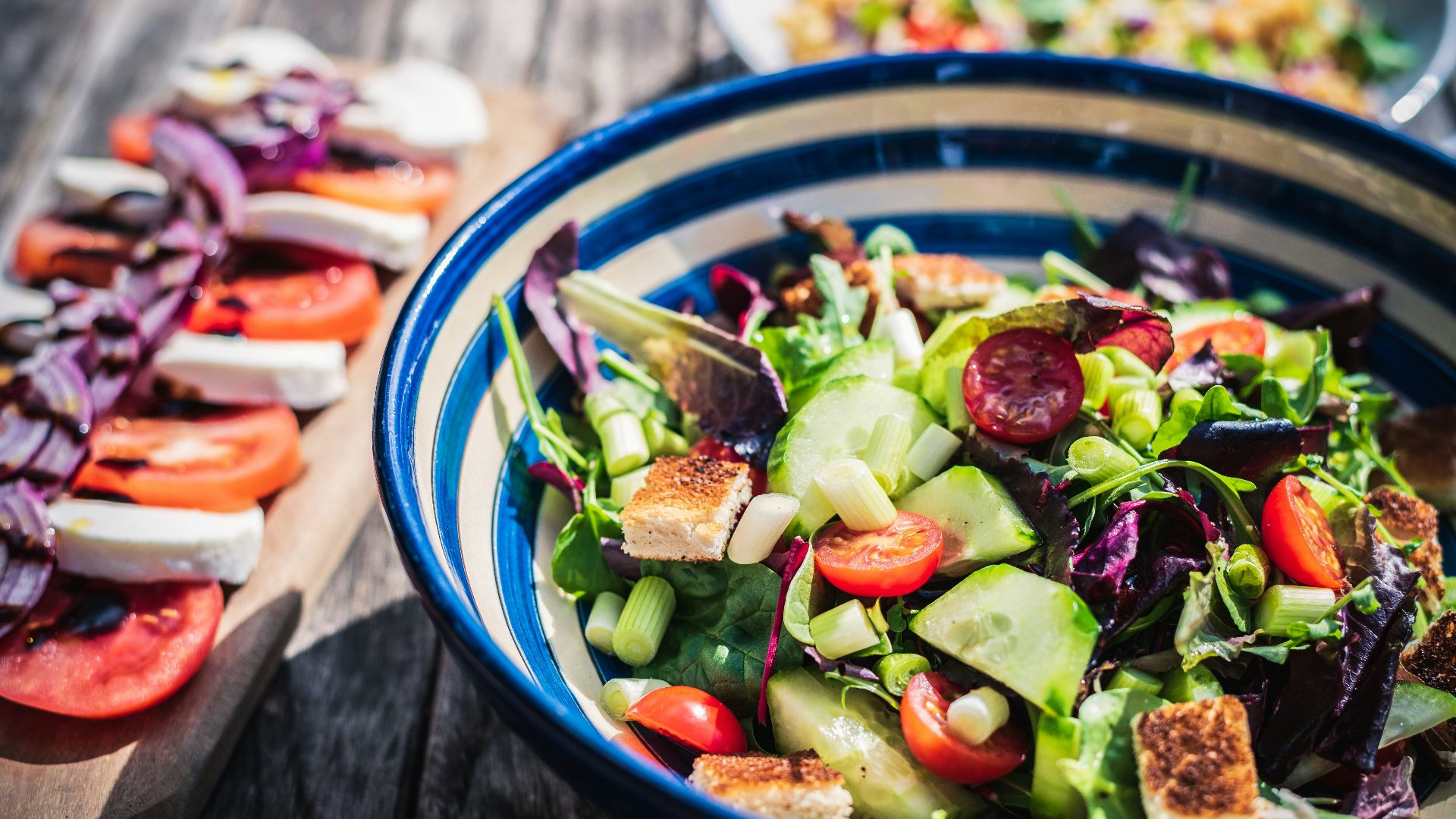 leafy vegetable dish in blue ceramic bowl