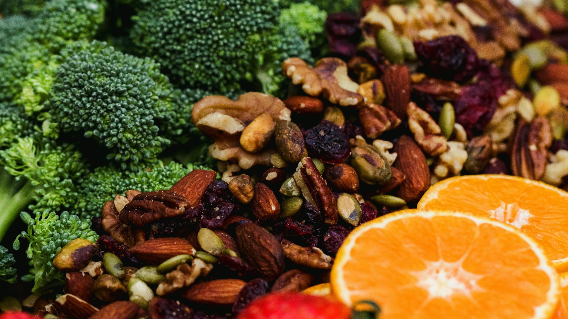 sliced orange fruit and green broccoli