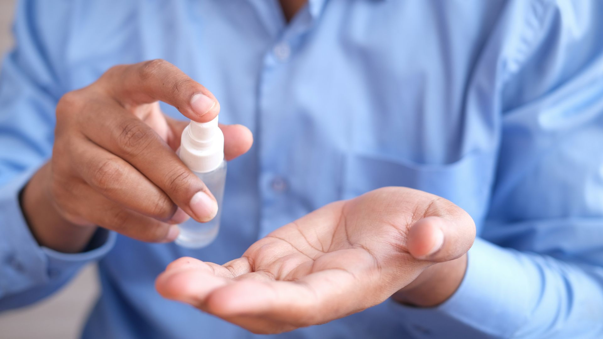 person holding white plastic bottle