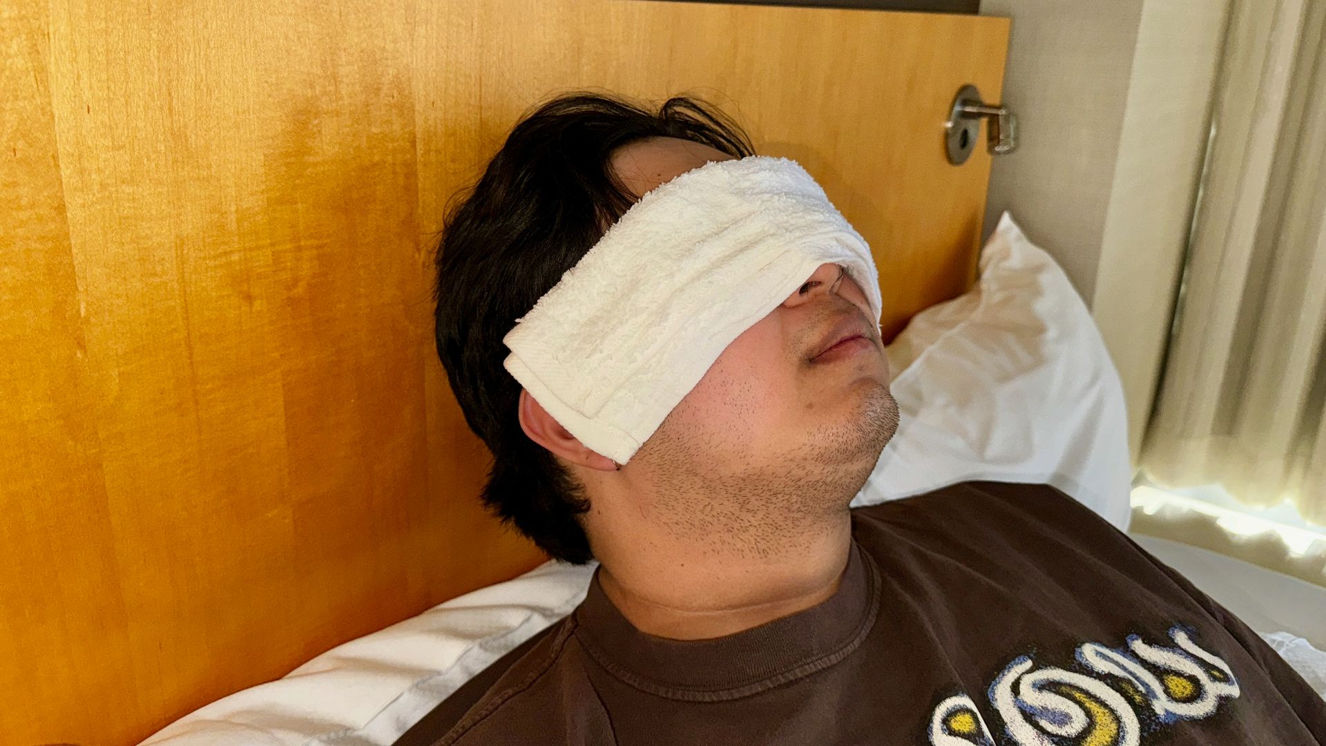 File:Warm Compress demonstrated with wet towel.jpg