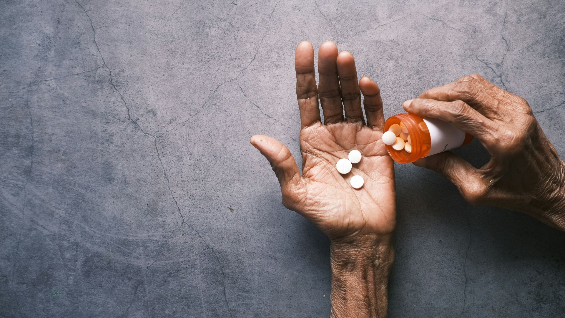 person holding white round ornament