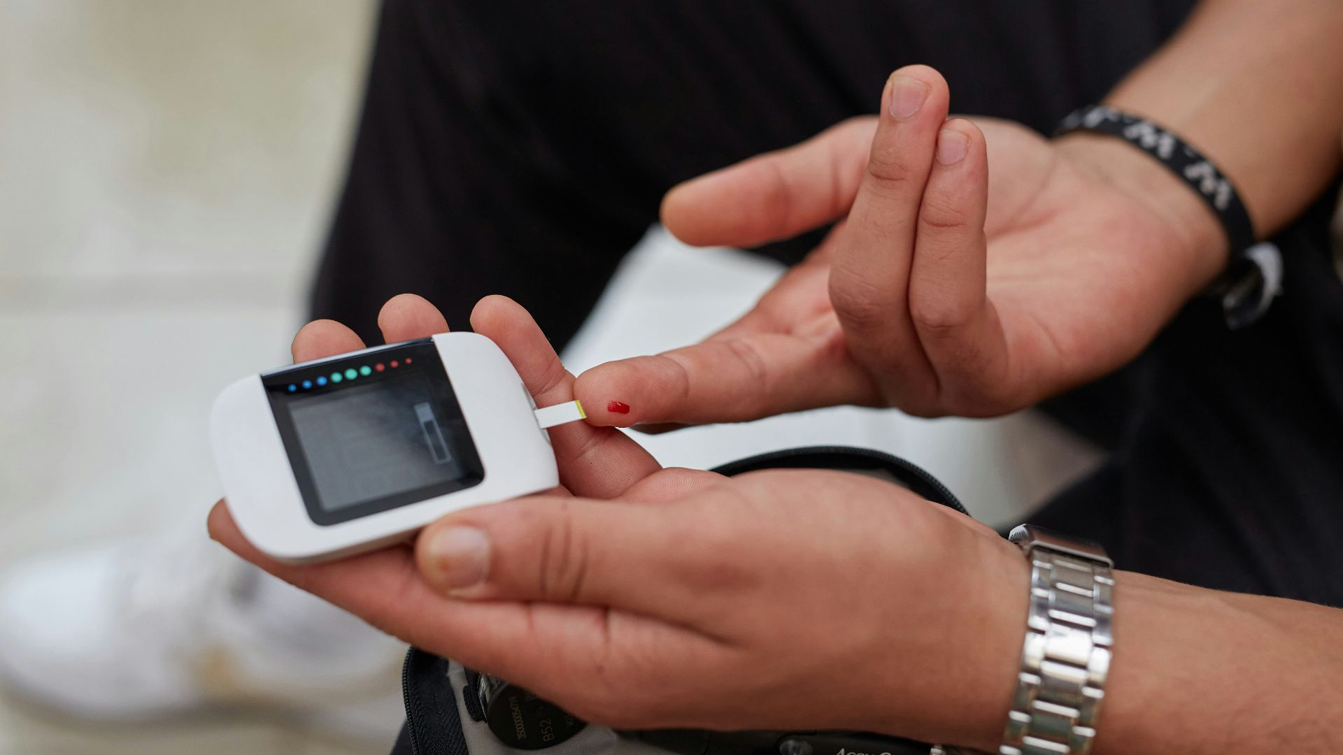 a person blood glucose testing using gluco-meter