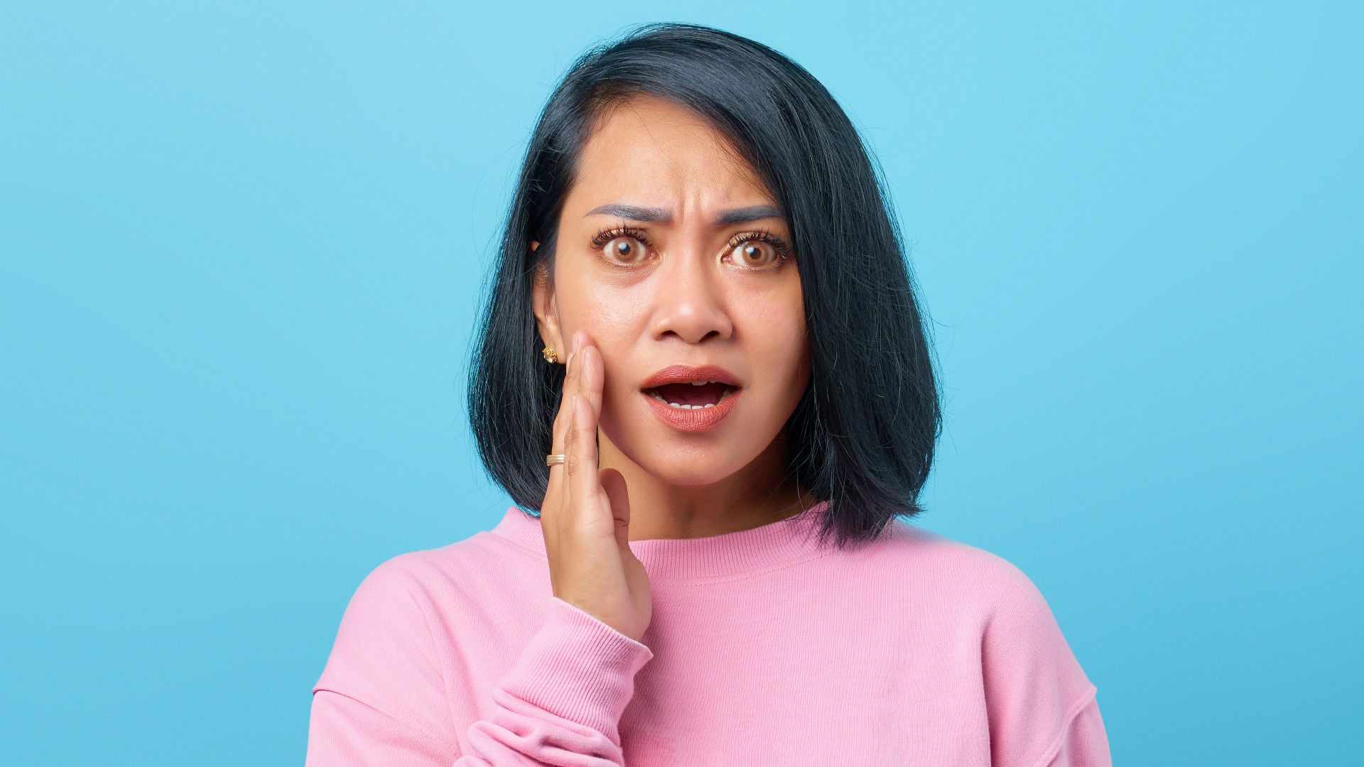a woman with a surprised look on her face
