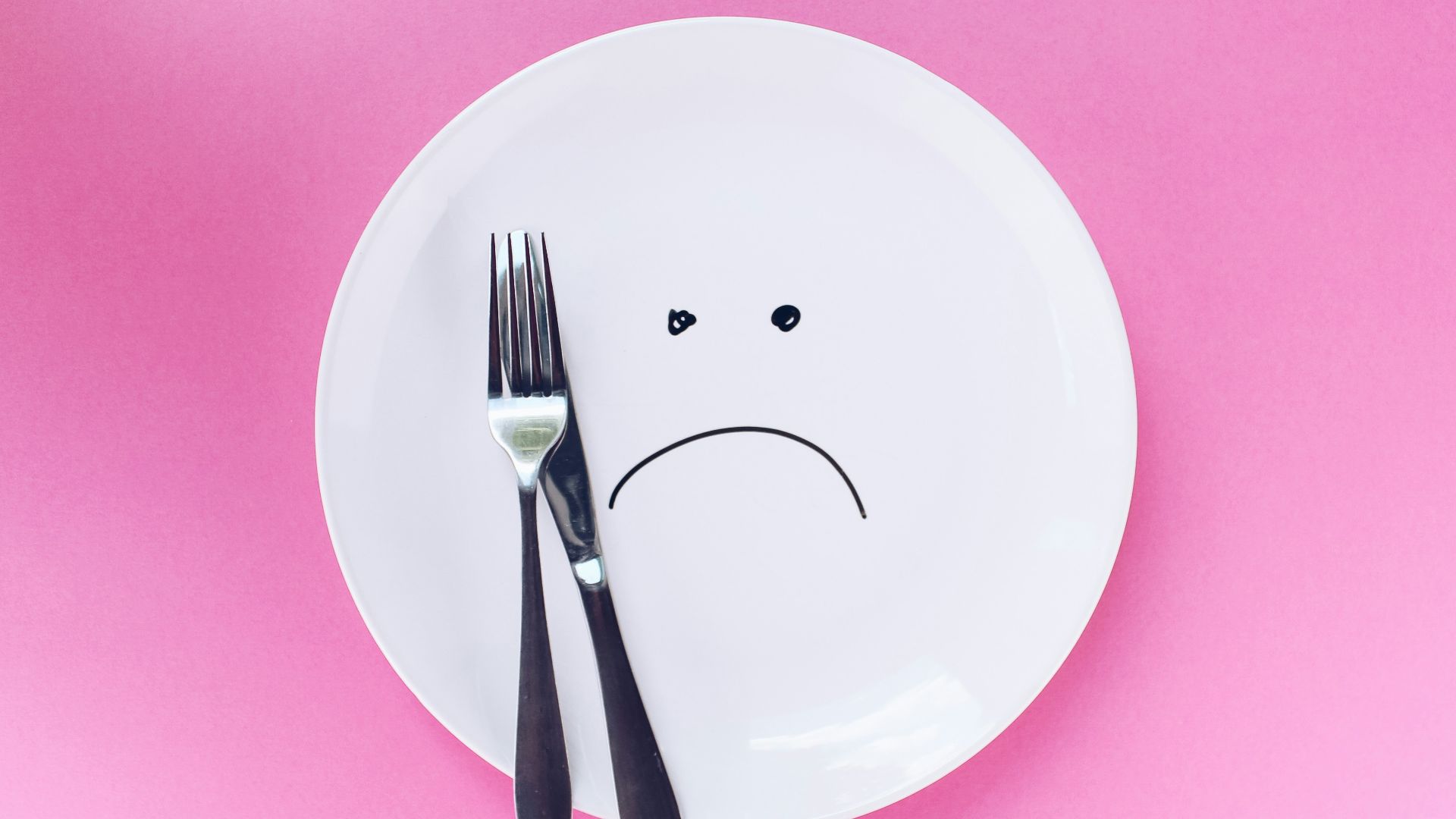 silver fork and knife on plate