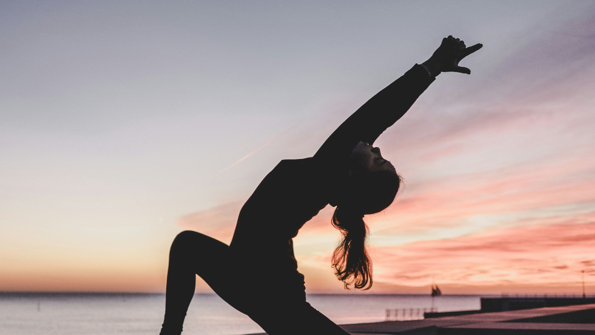 silhouette photography of woman doing yoga