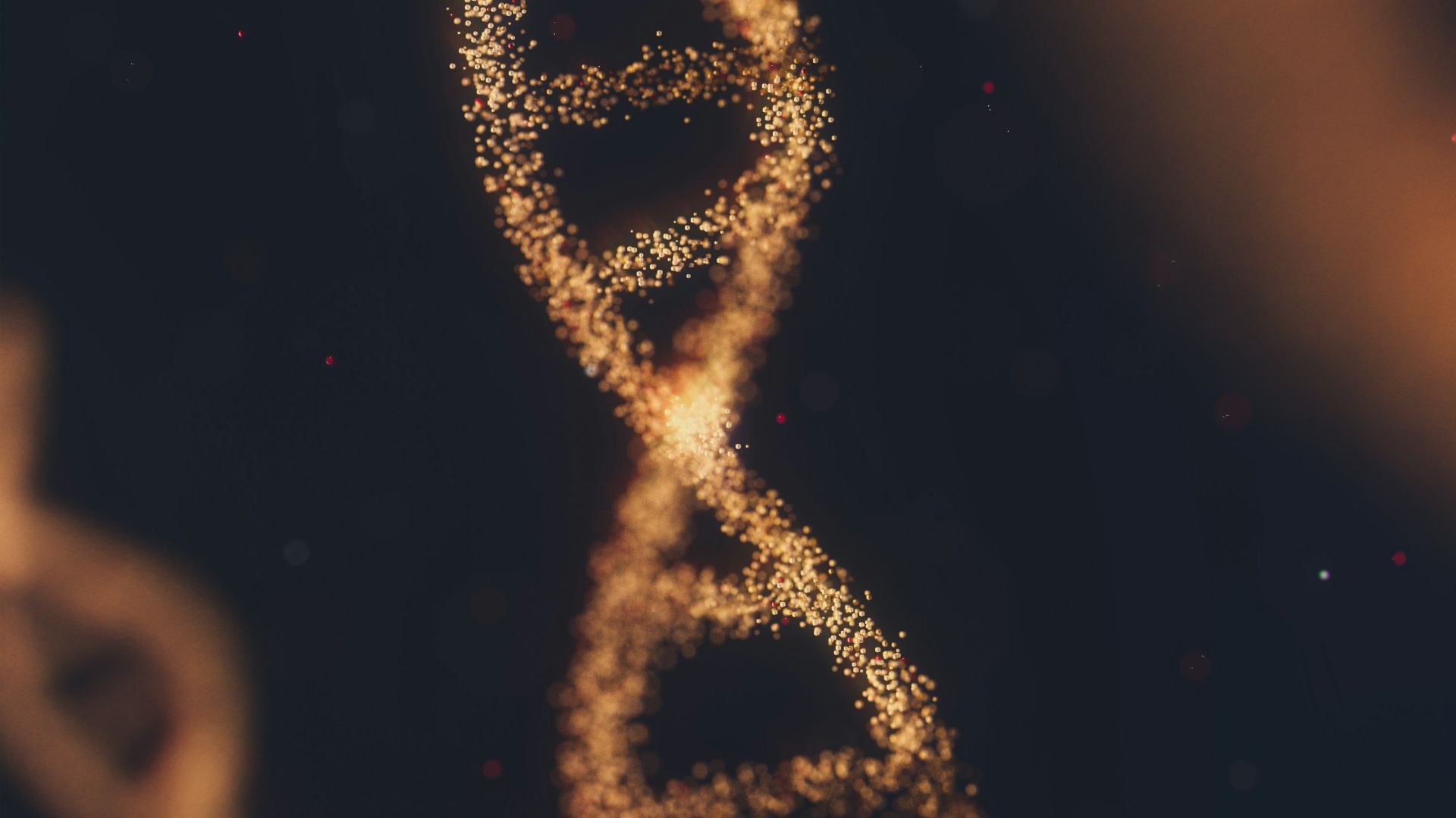 a close up of a double strand of gold glitter