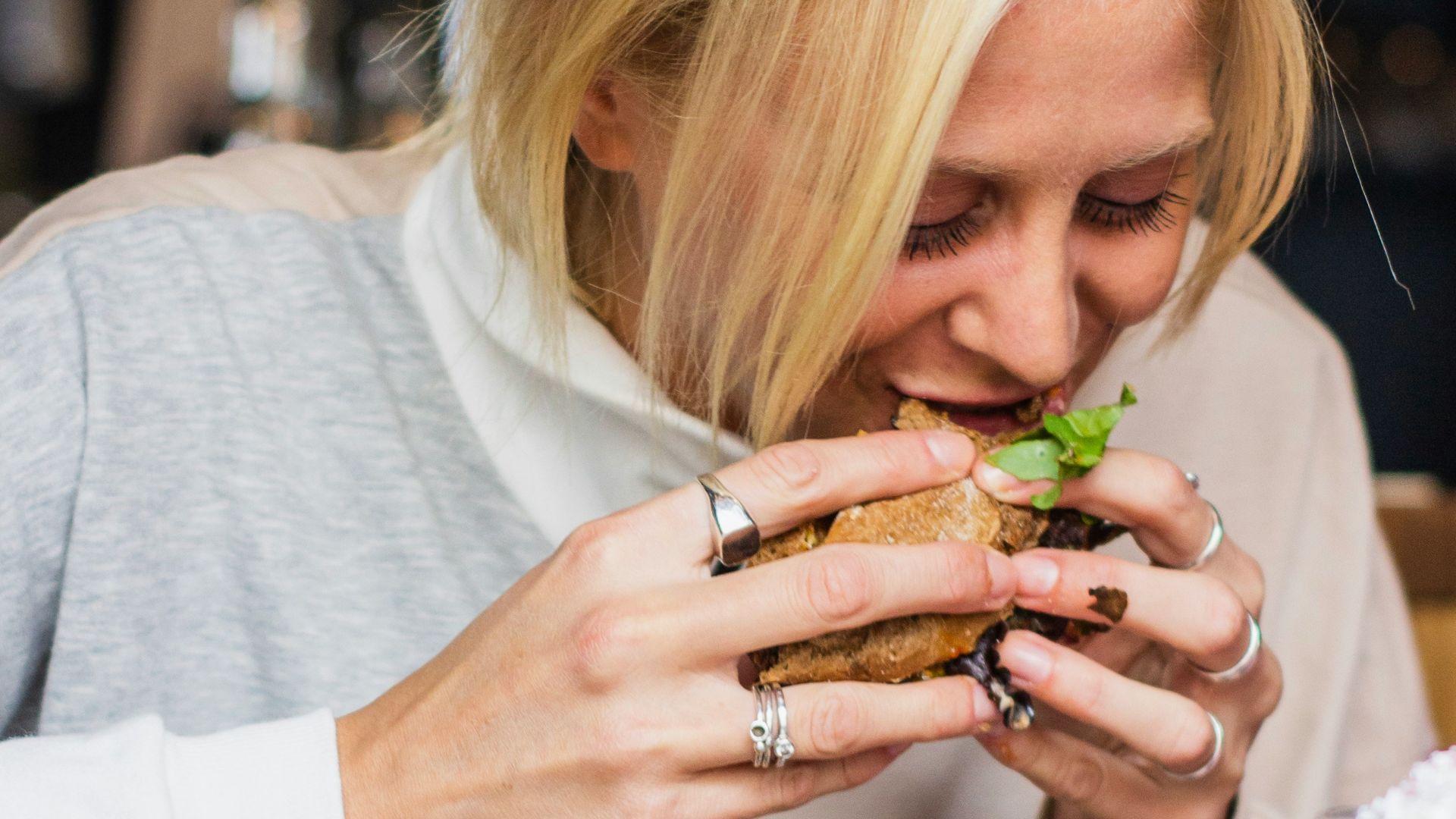 woman eating burger
