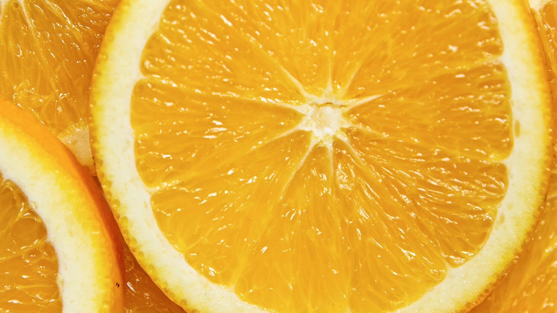 sliced orange fruit on white ceramic plate