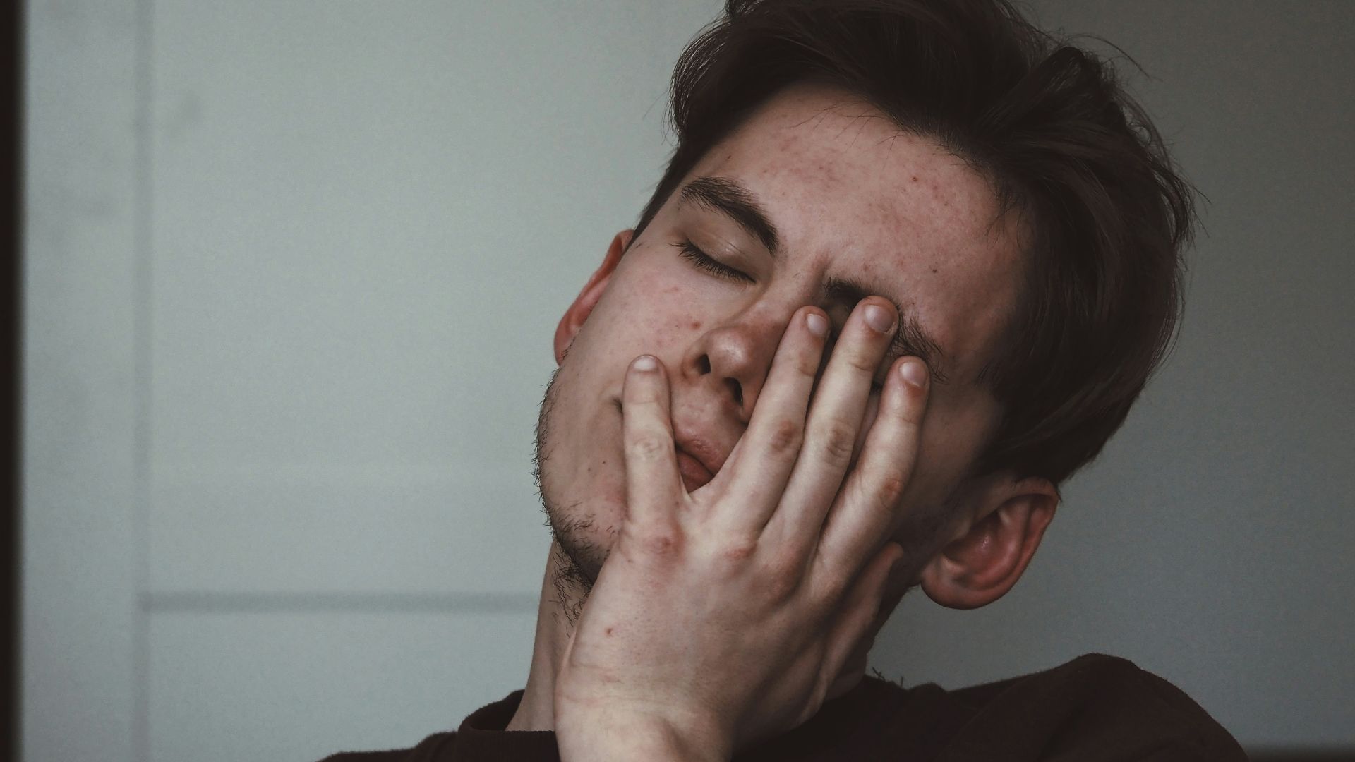 man wearing black crew-neck top