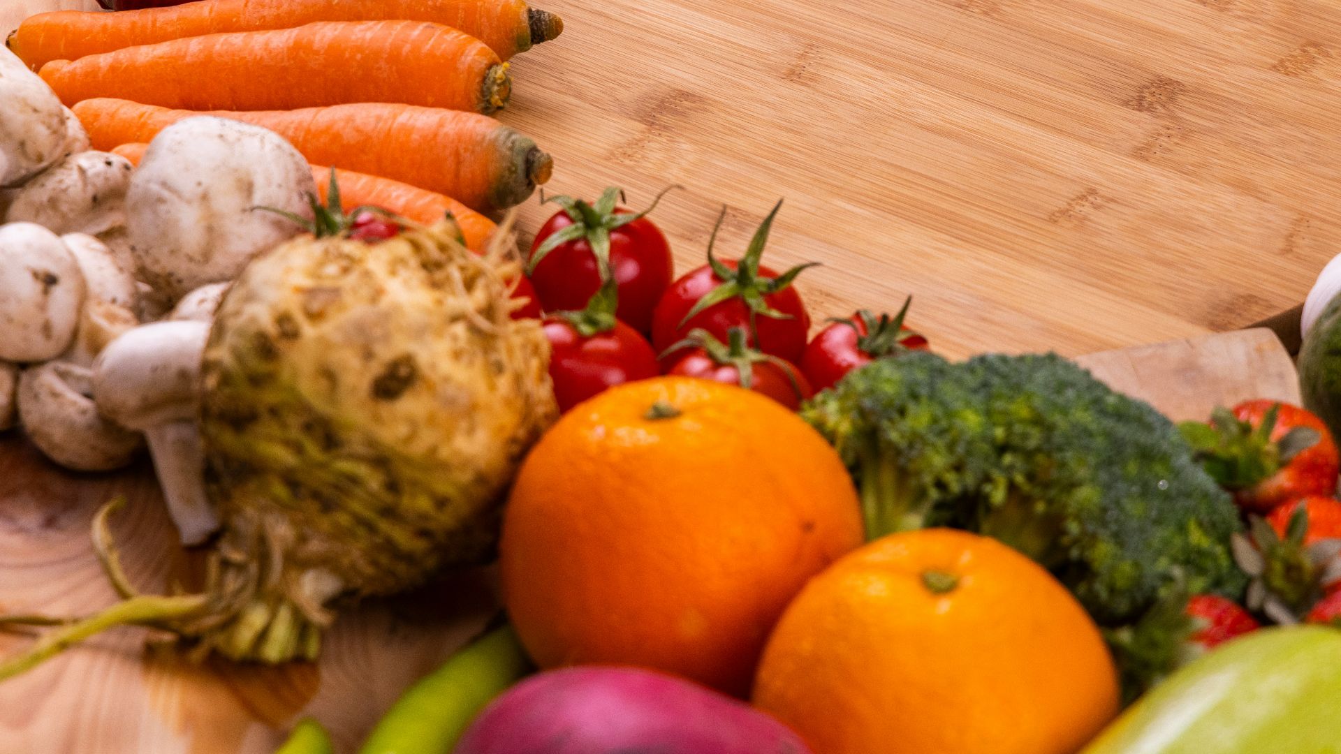 orange and green vegetables on brown wooden table