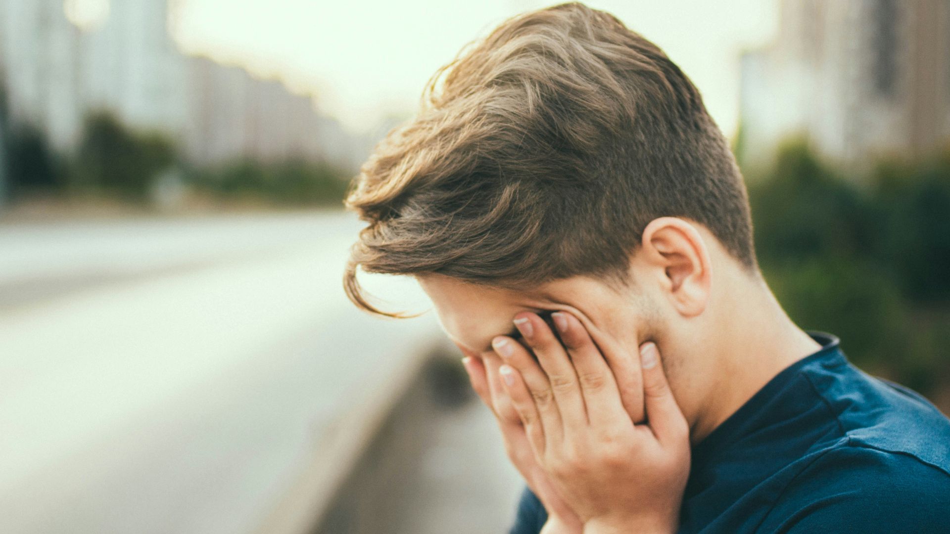 person covering own face