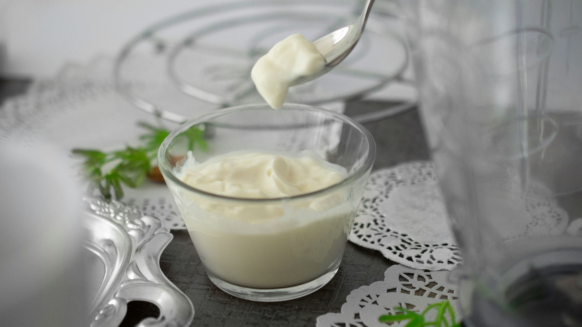 close-up photo of white cream in clear shot glass
