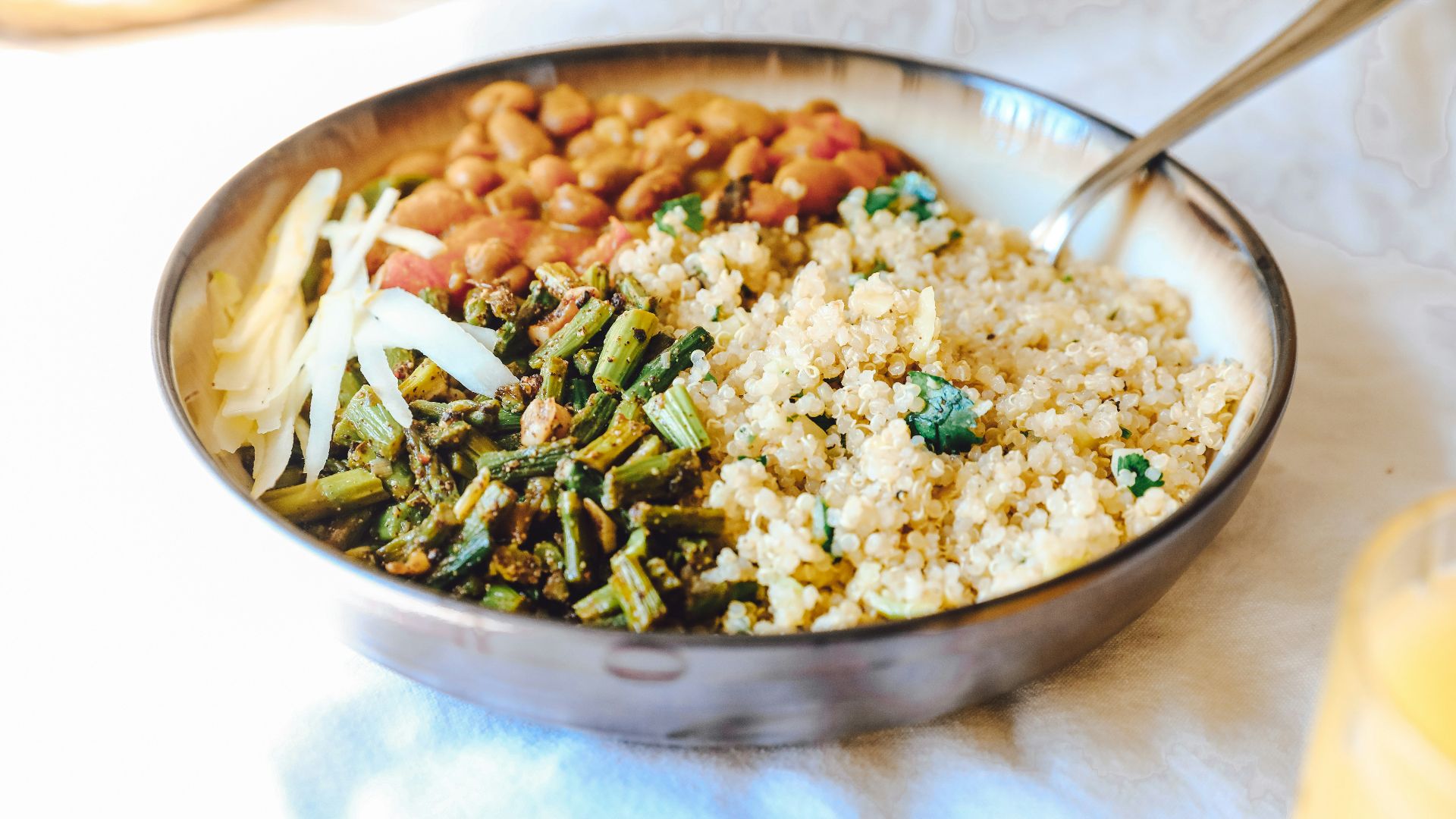 cooked rice with green peas and carrots on stainless steel bowl