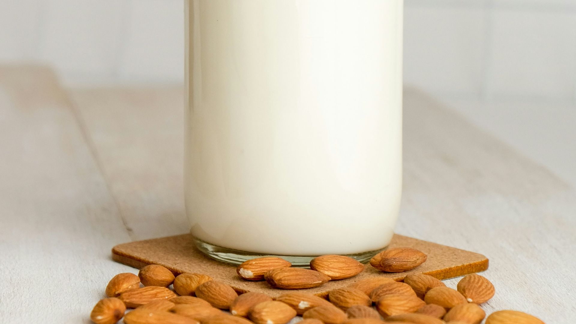 white milk in clear glass bottle