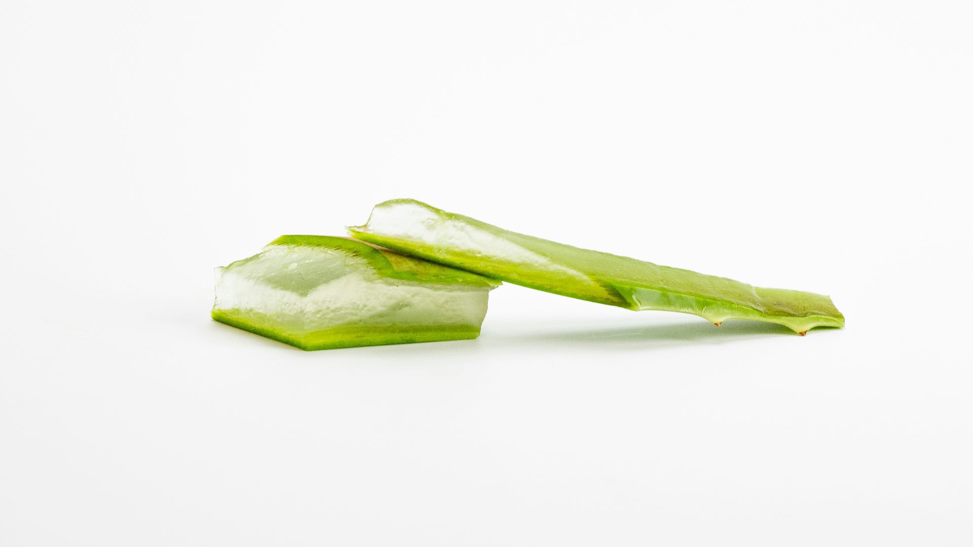 a piece of celery sitting on top of a white surface