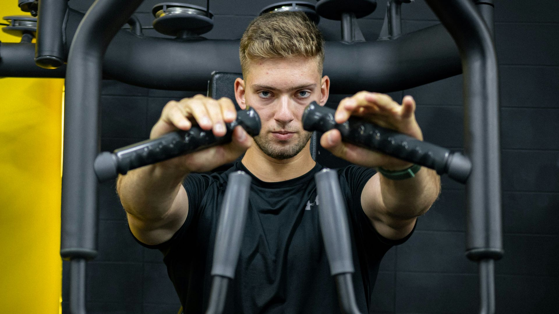 a man is doing exercises on a machine