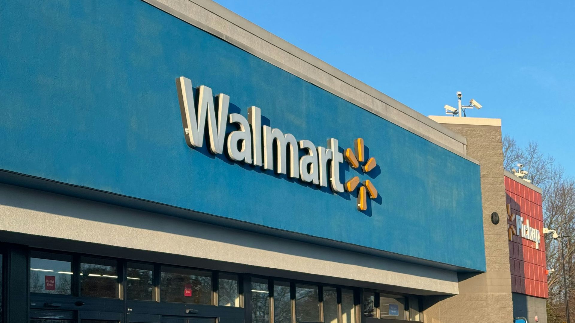 a walmart store with a car parked in front of it