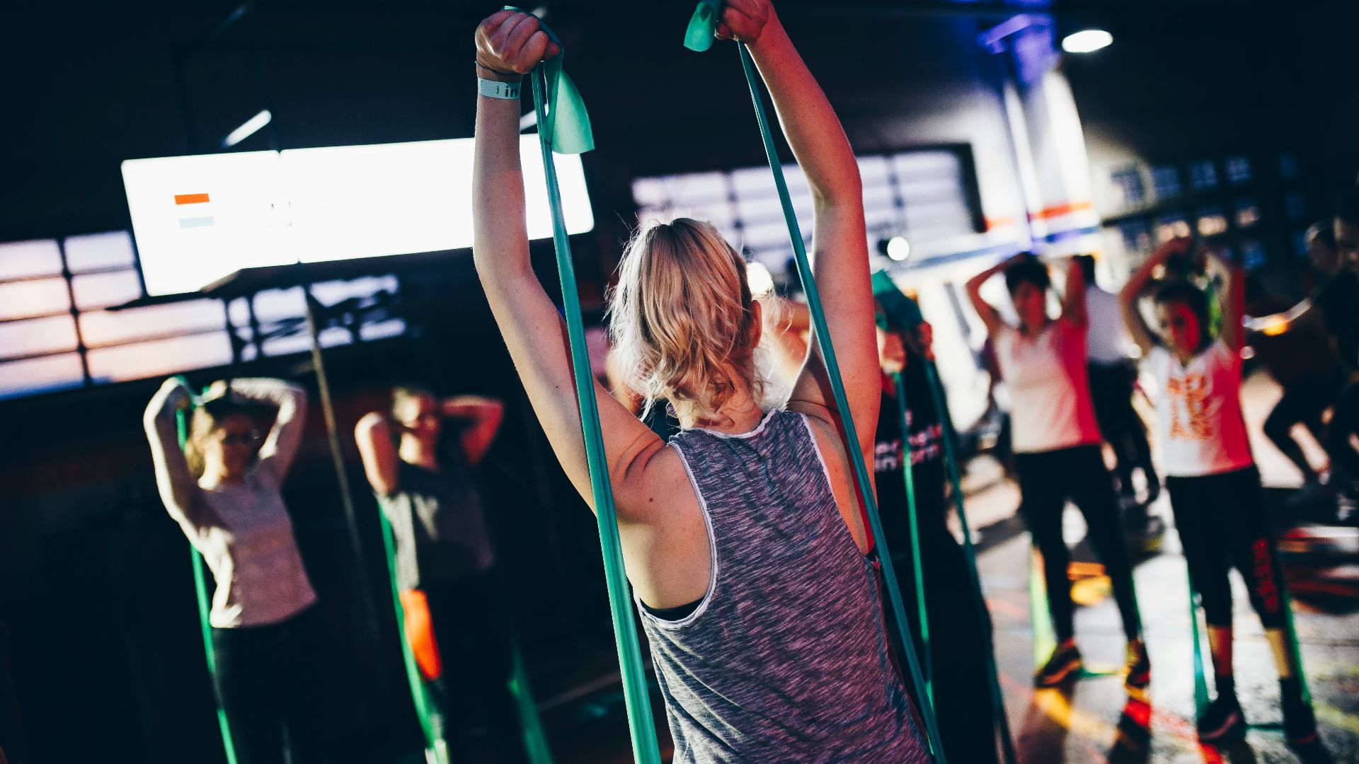 group of people in gym while exercising