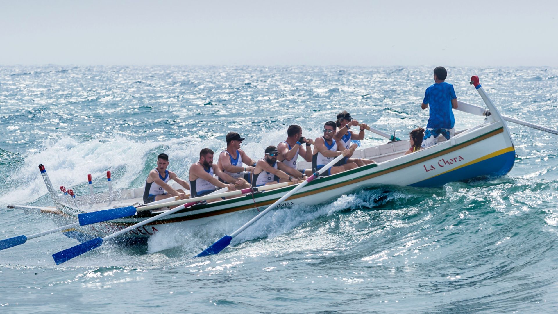 group of men riding boat