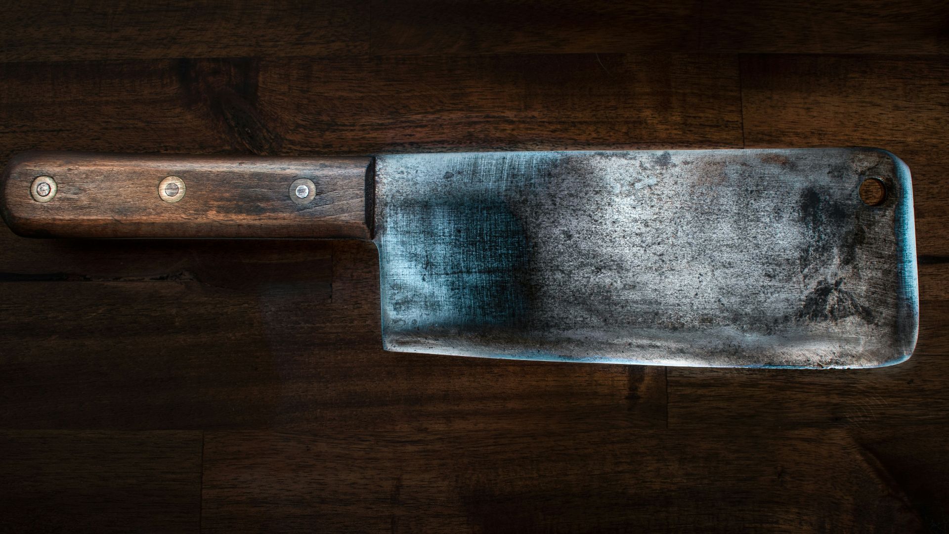 brown handle knife on brown wooden table