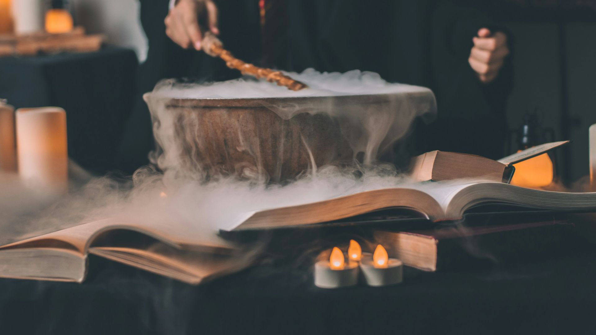 person holding wand on top of bowl