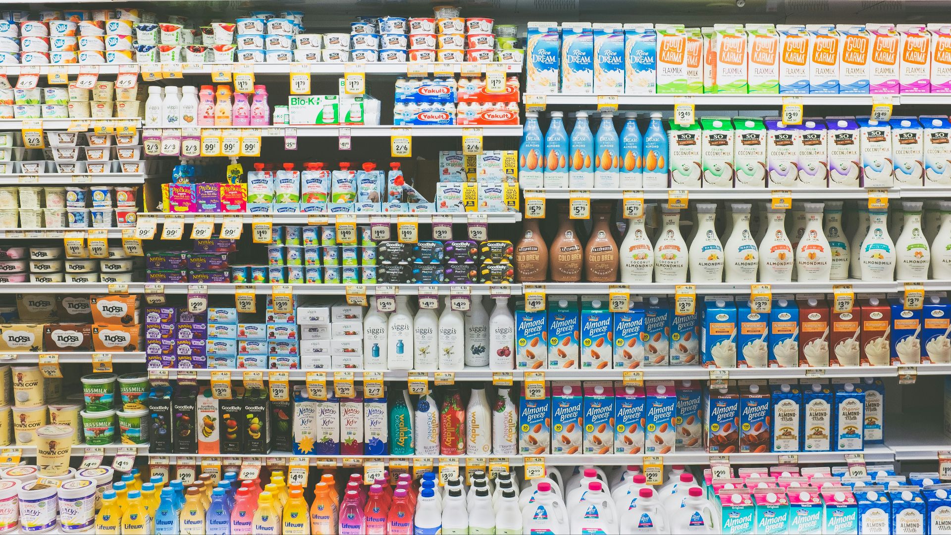 assorted drinks on white commercial refrigerator