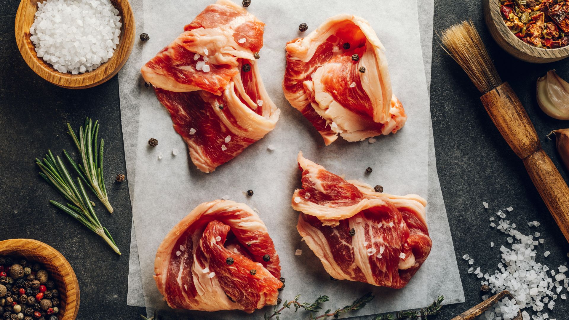 a group of raw fish on a cutting board