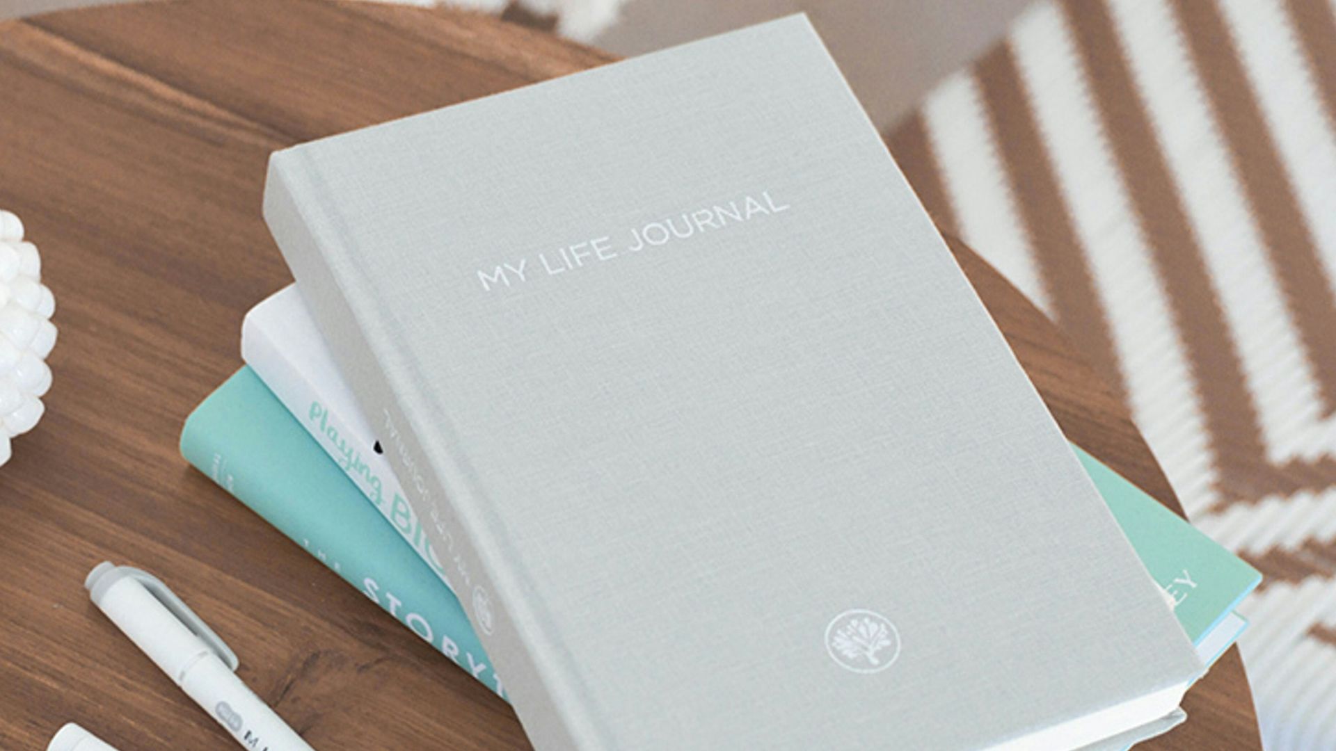 grey labeled book besidepens