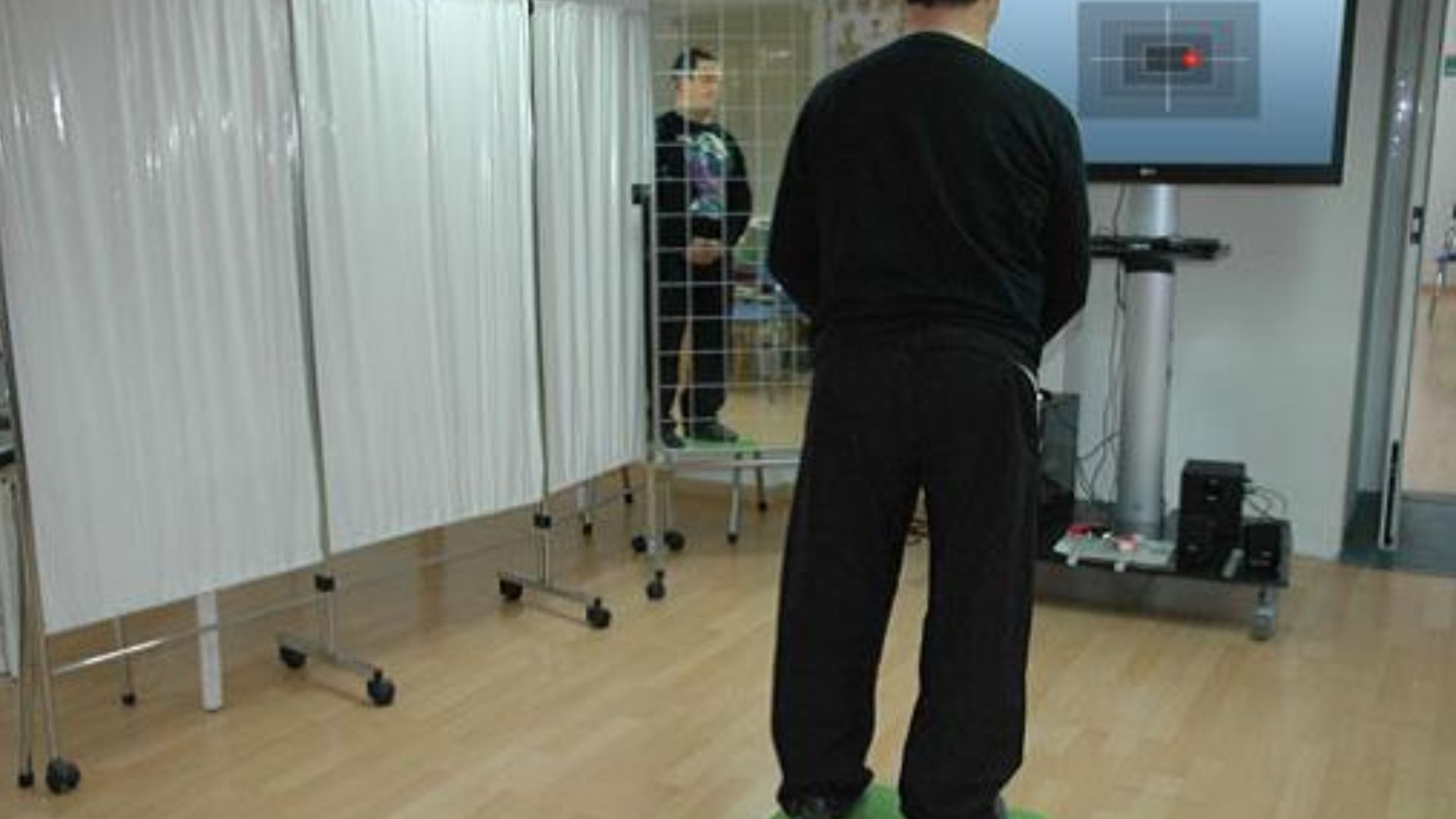 File:Patient on balance board for rehabilitation.jpg