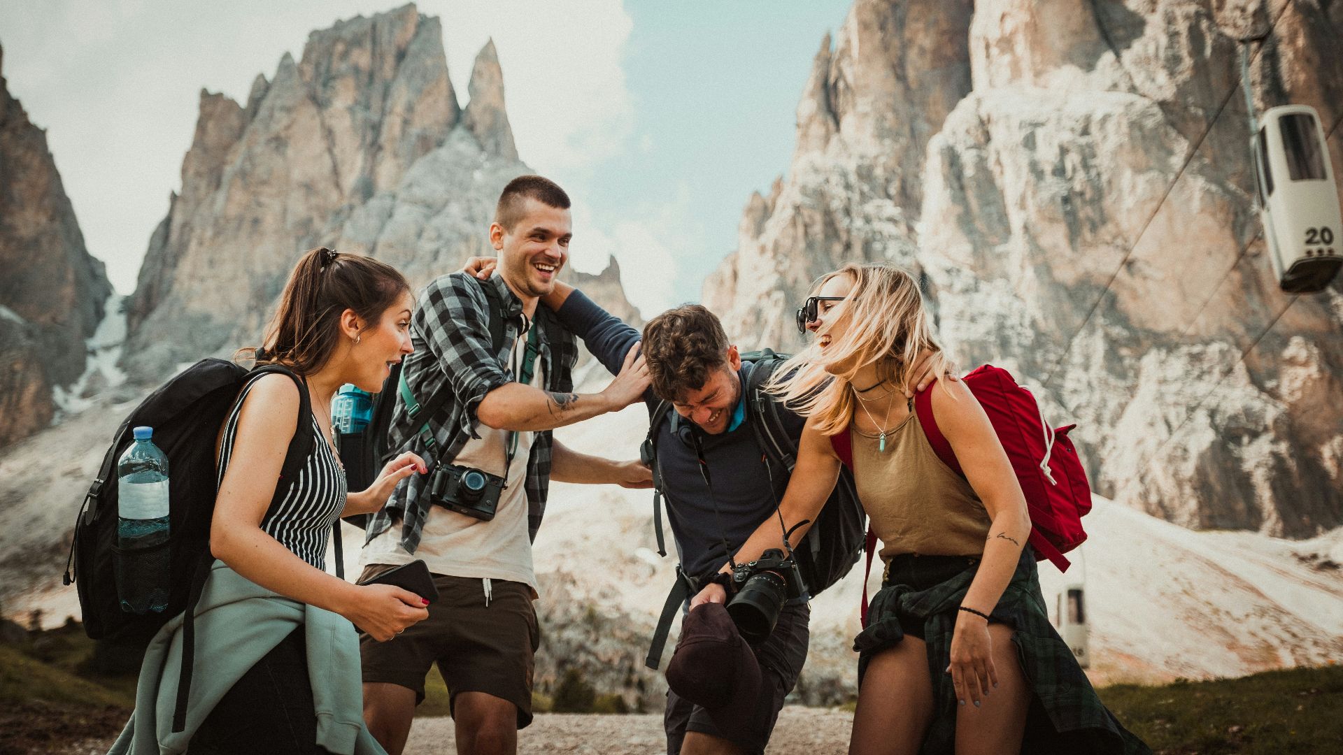 low-angle photography of two men playing beside two women