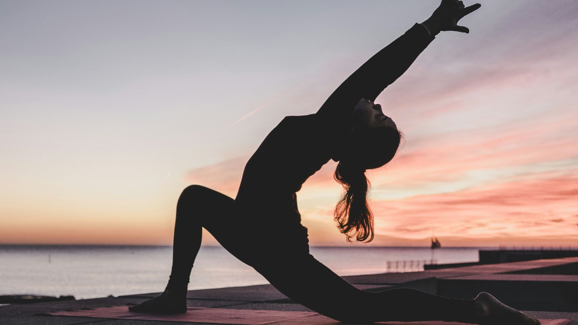 silhouette photography of woman doing yoga