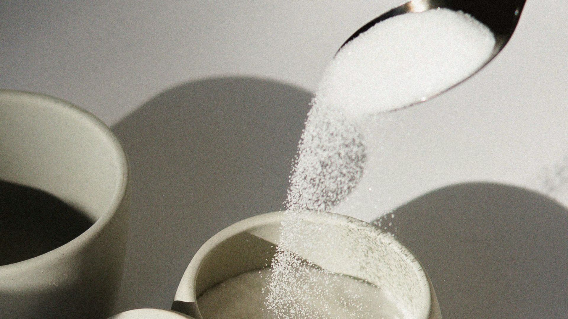 white ceramic mugs on white table