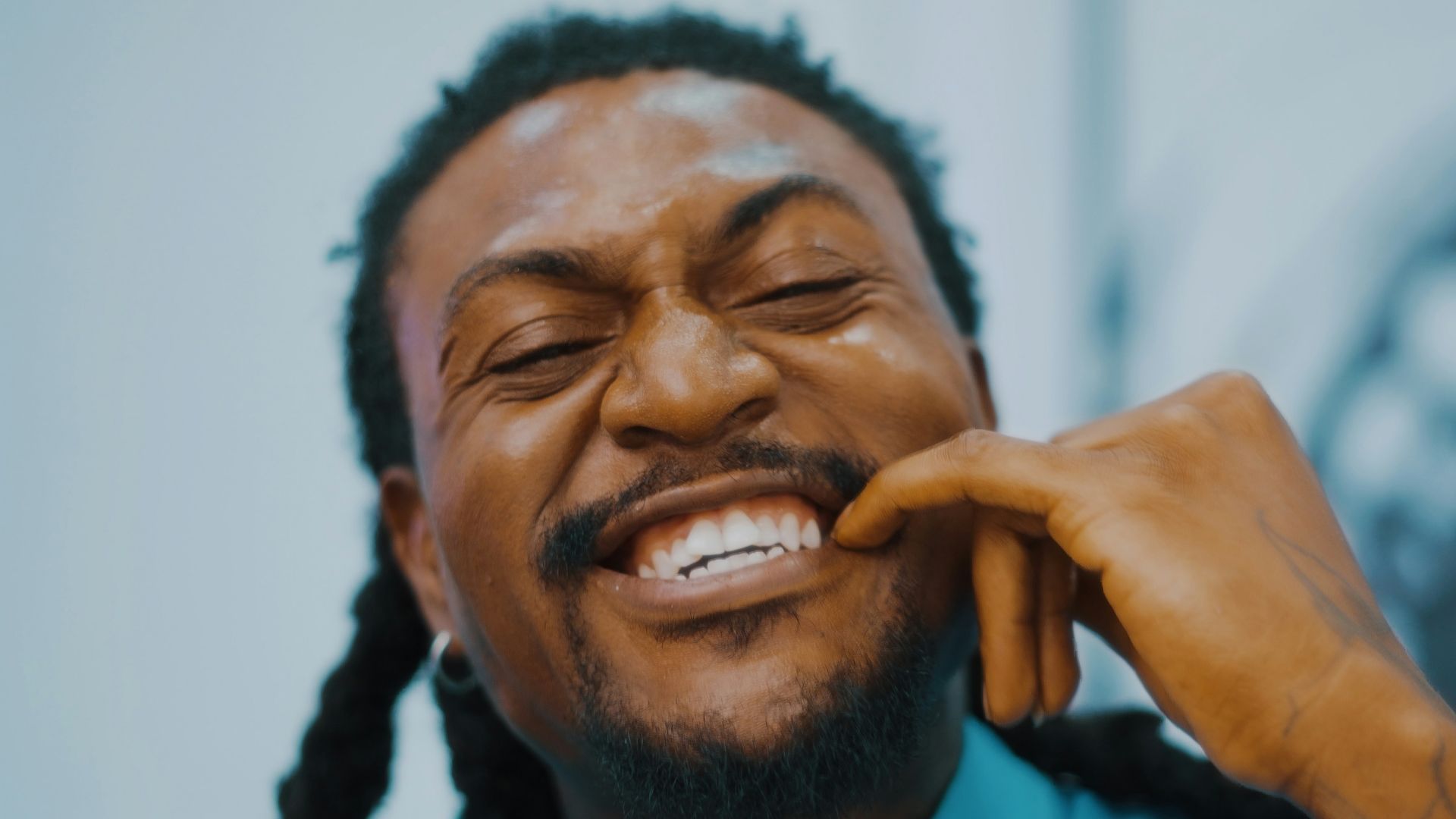 a close up of a person talking on a cell phone