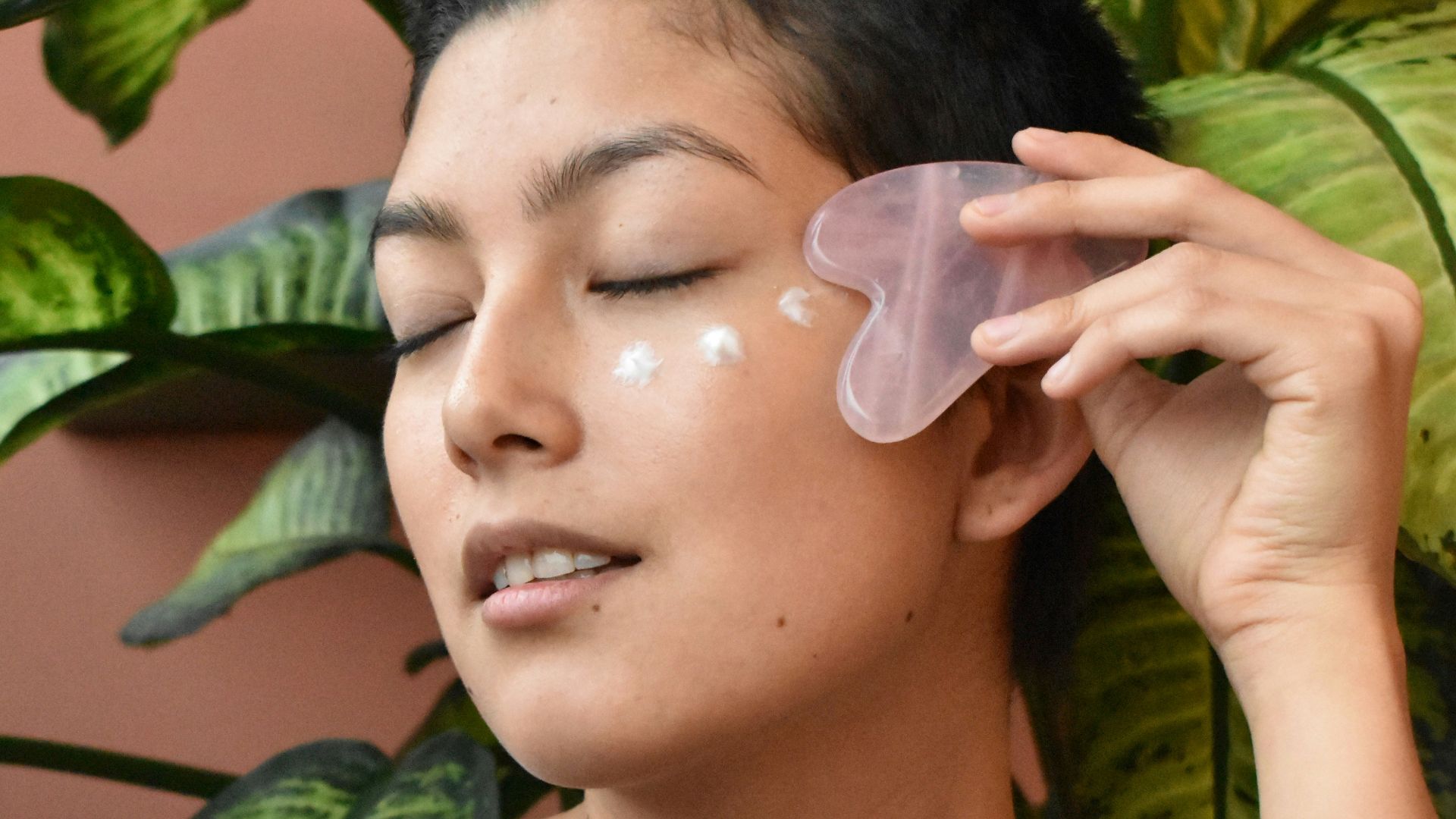 a woman holding a green object in her hand