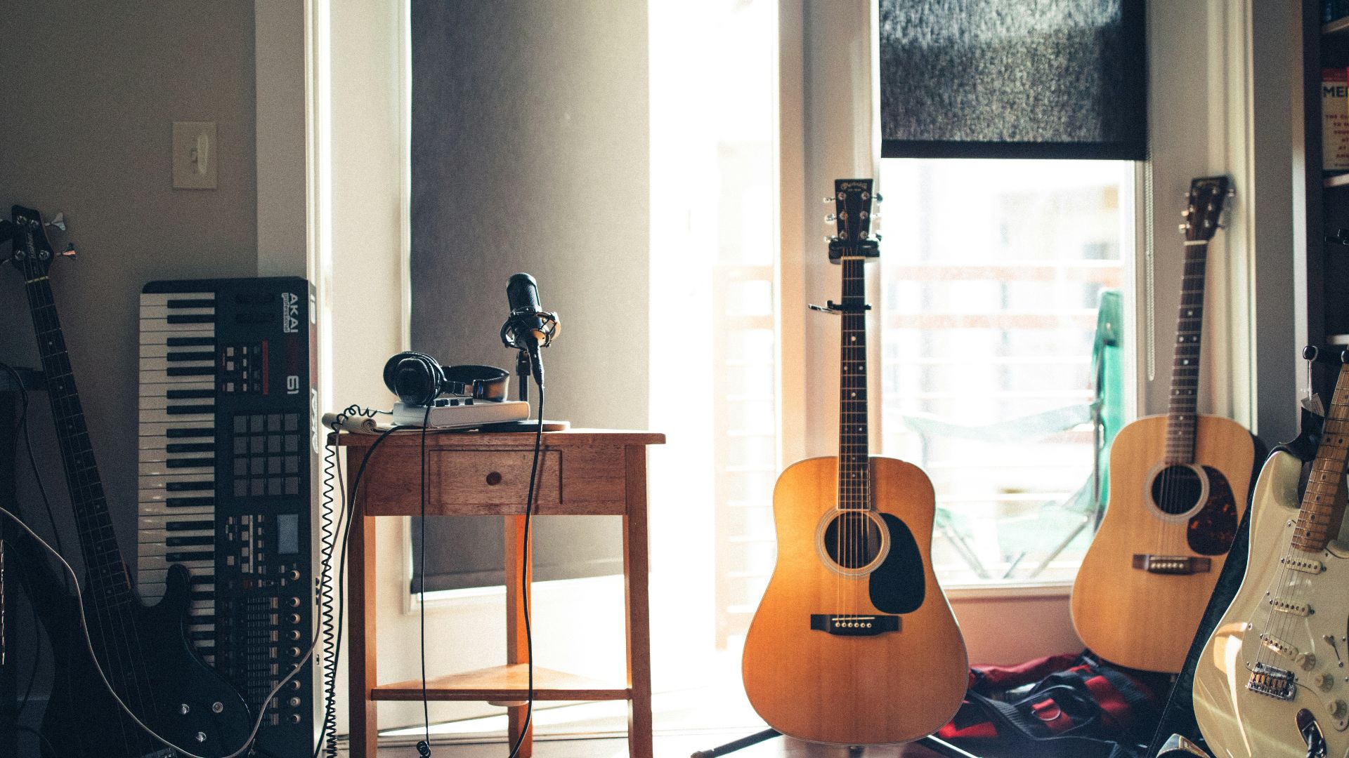 several guitars beside of side table
