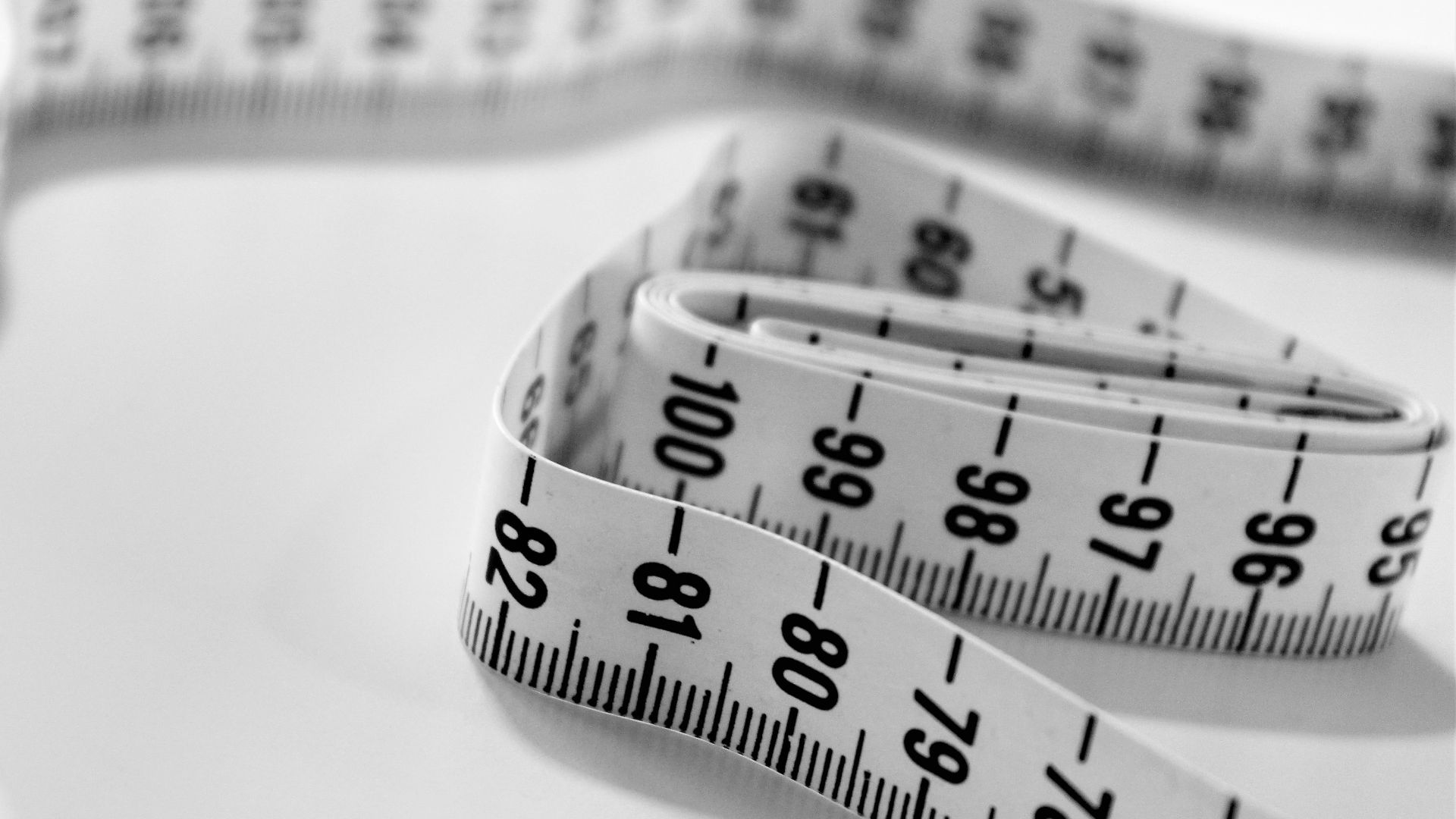 selective focus photography of tape measure