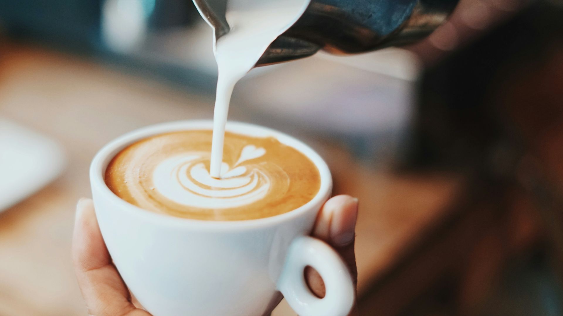 person making latte art