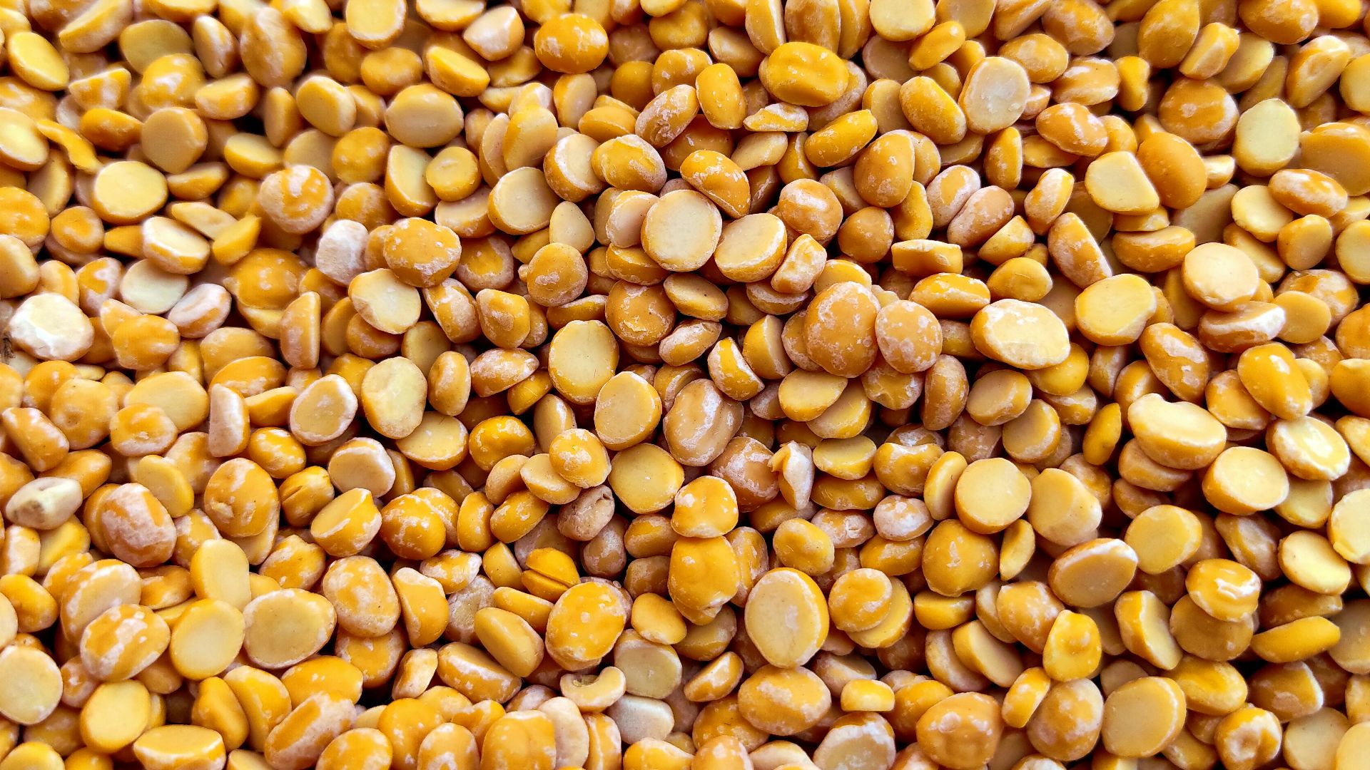 yellow and brown beans on brown wooden table