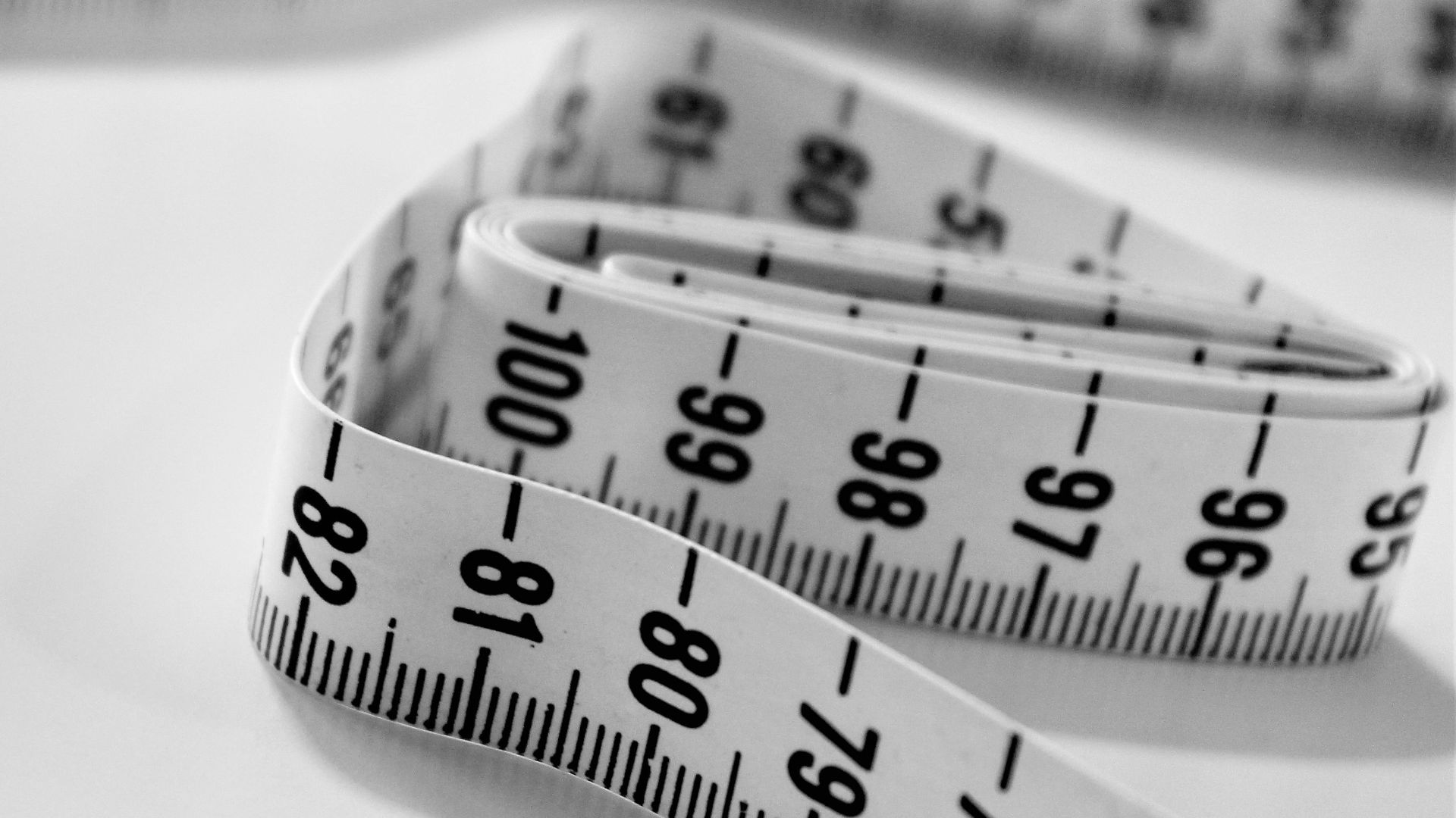 selective focus photography of tape measure