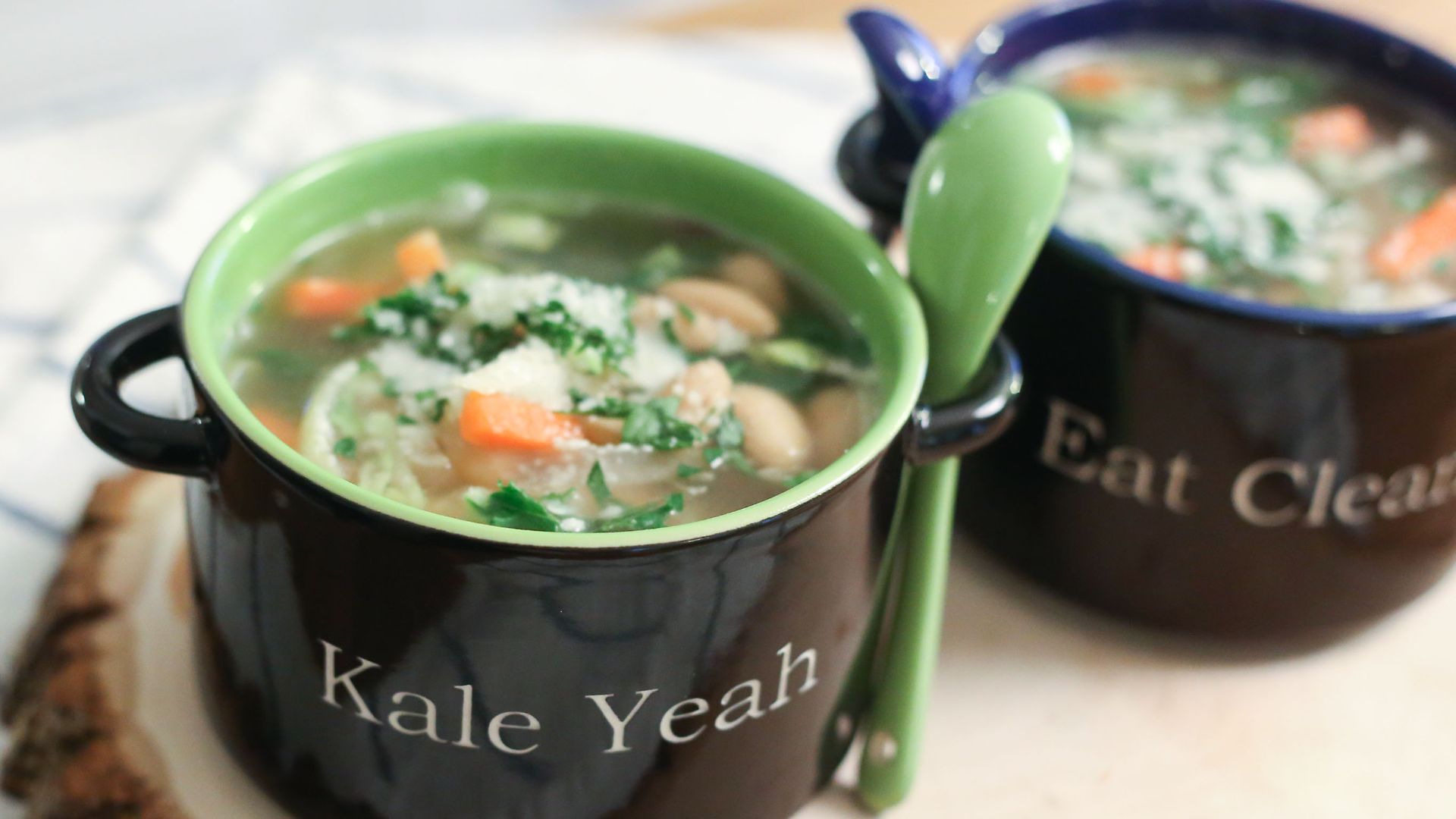 File:Tuscan kale and white bean soup in personalized bowls with spoons on a decorative tree cross cut (16085794138).jpg