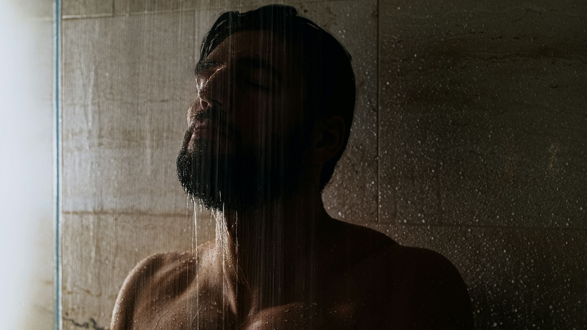 topless woman with black and white plaid scarf